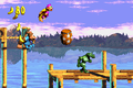 The Kongs jump to the Star Barrel in the Game Boy Advance remake