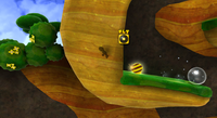 Bee Luigi stuck in a wall in the Honeyhop Galaxy due to a glitch.