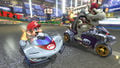Mario racing in the P-Wing on Mario Kart Stadium