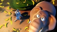 A zebra and elephant are freed from the Tiki Tak Tribe's hypnosis in Donkey Kong Country Returns HD.