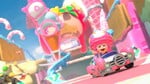 Toadette waving while driving on the course
