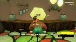 Donkey Kong purchasing a Banandium Gem at the Forest Layer Chip Exchange in Donkey Kong Bananza