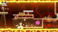 The third 10-flower coin in the Wavy Ride through the Magma Tube level in Super Mario Bros. Wonder