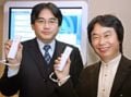 Satoru Iwata and Shigeru Miyamoto together, holding their Wii Remotes