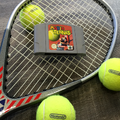 Photograph of a Mario Tennis cartridge alongside tennis equipment, posted by Nintendo on social media to promote the game's Wii U Virtual Console release