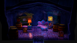 Mario next to the Shine Sprite in the treasure room in Creepy Steeple in the remake of the Paper Mario: The Thousand-Year Door for the Nintendo Switch.