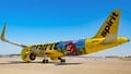 A Spirit Airlines Airbus A320neo with a Super Nintendo World-themed livery