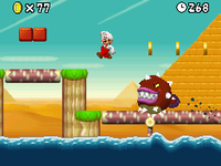 Screenshot of a Spike Bass leaping at Mario in New Super Mario Bros.