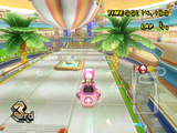 Toadette racing on Coconut Mall