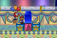 A Sky Guy chasing Mario in Shy Guy's Toy Box from Paper Mario