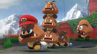 E3 2017 screenshot of Mario (as a Goomba) and other Goombas in the Wooded Kingdom of Super Mario Odyssey.
