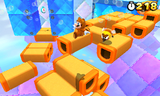 Tanooki Mario in another area with Donut Blocks.