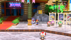 Mario at a hidden ? Block location in Glitzville, in the remake of the Paper Mario: The Thousand-Year Door for the Nintendo Switch.