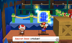 Mario picking up a Secret Door Sticker after defeating 2 Shy Guys in Bowser's Snow Fort of Paper Mario: Sticker Star.