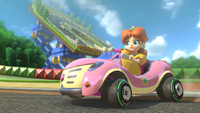 Princess Daisy riding her Cat Cruiser through Mario Circuit in Mario Kart 8