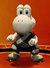 Image of Yoshi in a grey/white uniform, from Mario Strikers: Battle League