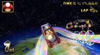 Funky Kong flying over the slope in Rainbow Road.