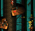 The characters bounce off a tire to reach a higher platform
