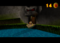 Chunky Kong in a Mine Mine Cart in a Minecart Race about to enter a cave in the game Donkey Kong 64
