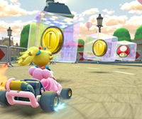 Thumbnail of the Pink Gold Peach Cup challenge from the 2nd Anniversary Tour; a Break Item Boxes challenge set on Paris Promenade 2 (reused as the Cat Peach Cup's bonus challenge in the Metropolitan Tour)