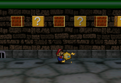 Image of Mario revealing a hidden ? Block in Toad Town Tunnels, in Paper Mario.