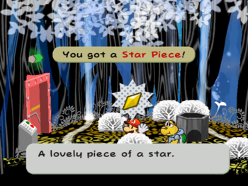 Mario getting the Star Piece in a clump of grass in the shortcut room in the Great Tree.