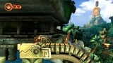 The Donkey Kong statue holding a Joy-Con in the background of Wonky Waterway