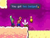 Mario and Luigi obtaining their first badges in Mario & Luigi: Bowser's Inside Story.