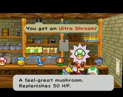 Mario getting an Ultra Shroom from Plenn T. in Rogueport of Paper Mario: The Thousand-Year Door.