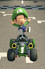 Baby Luigi performing a trick.