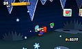 Mario pulls an Ice Flower sticker from the wall of a cave. A Save Block and Recovery Block can be seen.