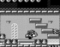 A development screenshot of the Game Boy version. Some coins overhead have either been removed or repositioned in the final.