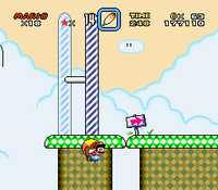 Mario flying under the Giant Gate that would lead him to Cookie Mountain. Instead, he will take the secret exit that leads to Soda Lake.
