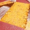 Screenshot of a grated cheese bridge from Donkey Kong Bananza.
