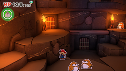 Mario standing near a stone slab containing a 100-Coin in Breezy Tunnel of The Origami King.
