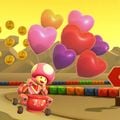 Toadette gliding with the Heart Balloons on SNES Choco Island 2