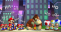 Mario, the Mini-Marios, and three Toads laughing at Donkey Kong