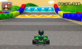 A Mii driving near the two types of Boost Pads in Mario Kart 7 (boost and glide) in SNES Mario Circuit 2.