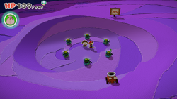 Mario standing near 6 Coin Bags in Scorching Sandpaper Far East of The Origami King.