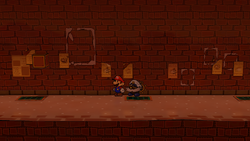 Mario near the poster containing a Spite Pouch in Riverside Station of Paper Mario: The Thousand-Year Door for Nintendo Switch.