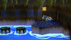 Mario using his Hammer to reveal a hidden "stepping stone" Coin ? Block in Pirate's Grotto, in the remake of the Paper Mario: The Thousand-Year Door for the Nintendo Switch.