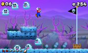 Mario approaching the goal in a ghost house level in New Super Mario Bros. 2