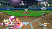 Toadette waits for a pitch from Wario.