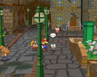 The green Toad walking on the street in the west scene of Rogueport.