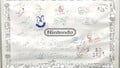 Signature wall from the Nintendo booth at E3 2019, featuring a doodle of Polterpup by Yoshihito Ikebata