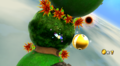 Rainbow Mario pursuing a Gold Chomp in Gusty Garden Galaxy.