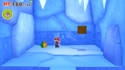 Mario standing near a Small Bag of Confetti on Ice Vellumental Mountain of The Origami King.