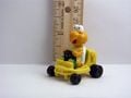 A figurine of Koopa from Super Mario Kart driving his kart