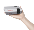 Hand holding NES Classic Edition as scale