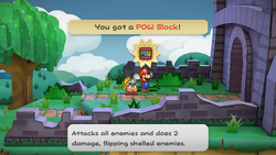 Mario getting the POW Block from a bush in the Path to Shhwonk Fortress of Paper Mario: The Thousand-Year Door for Nintendo Switch.